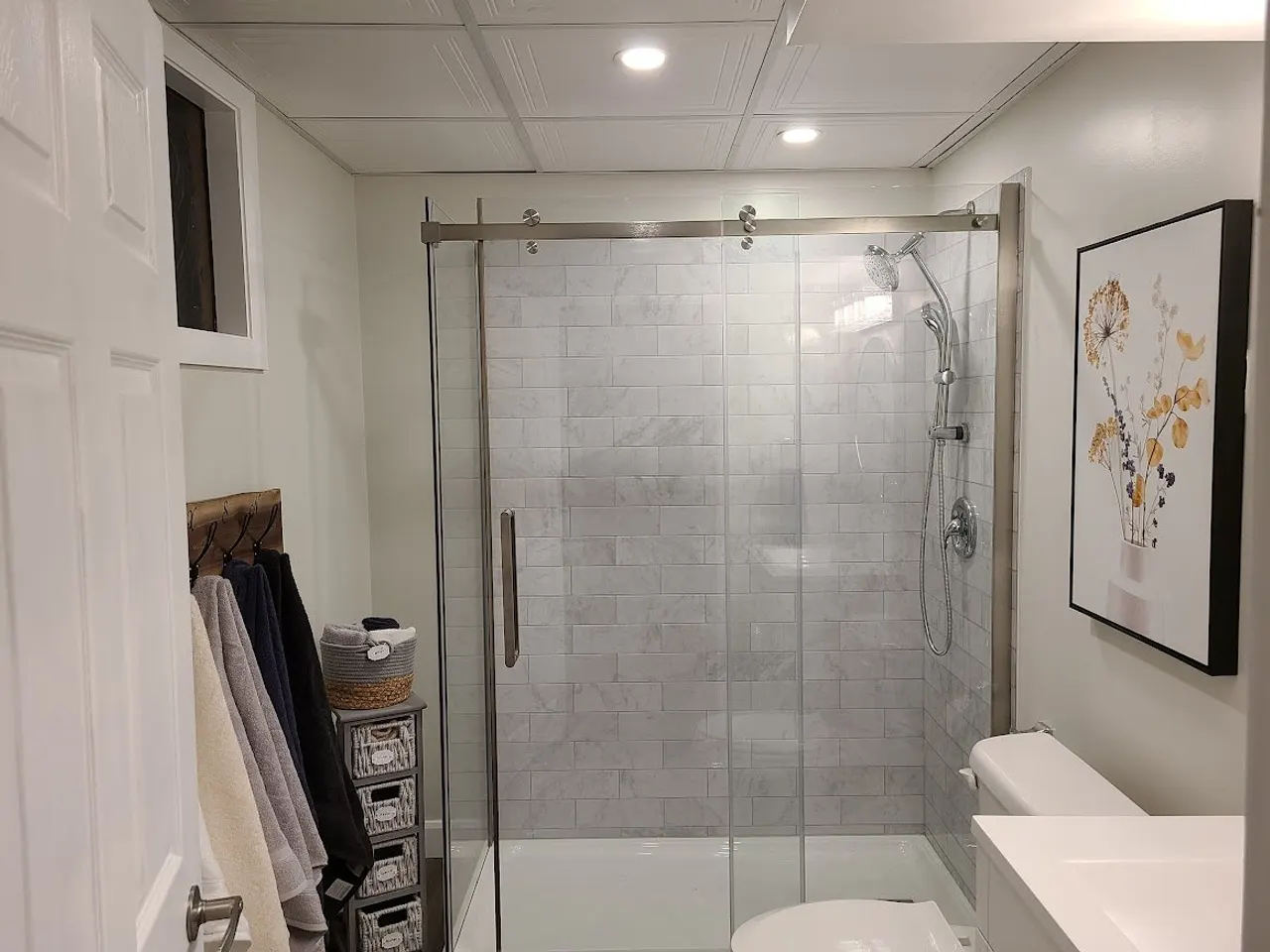 Basement bathroom, subway-tile walk-in shower in Carleton Place by ALM Construction