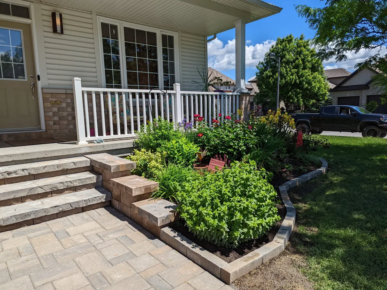 Front porch walkway and raised bed in Carleton Place by ALM Construction