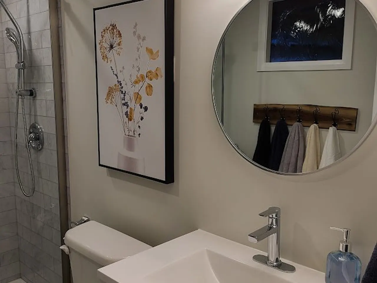 Modern bathroom with marble shower in Carp by ALM Construction